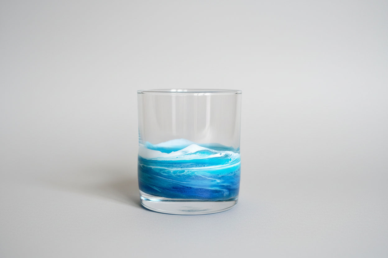 Clear glass with blue and white resin wave design on a light gray background