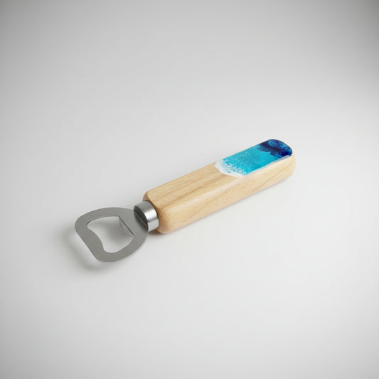 Bottle opener with wooden handle and blue resin wave accent on a light gray background